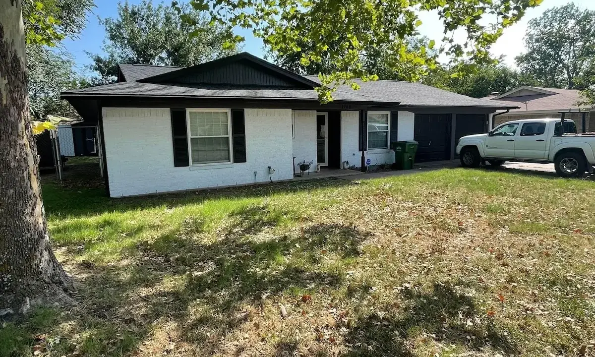 Professional roofing crew working on a residential roof in Lysander